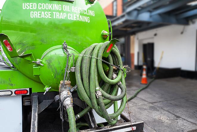 grease trap being pumped at a restaurant kitchen in Grand Haven